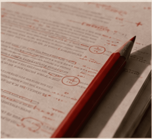 Marked-up manuscript with red pencil